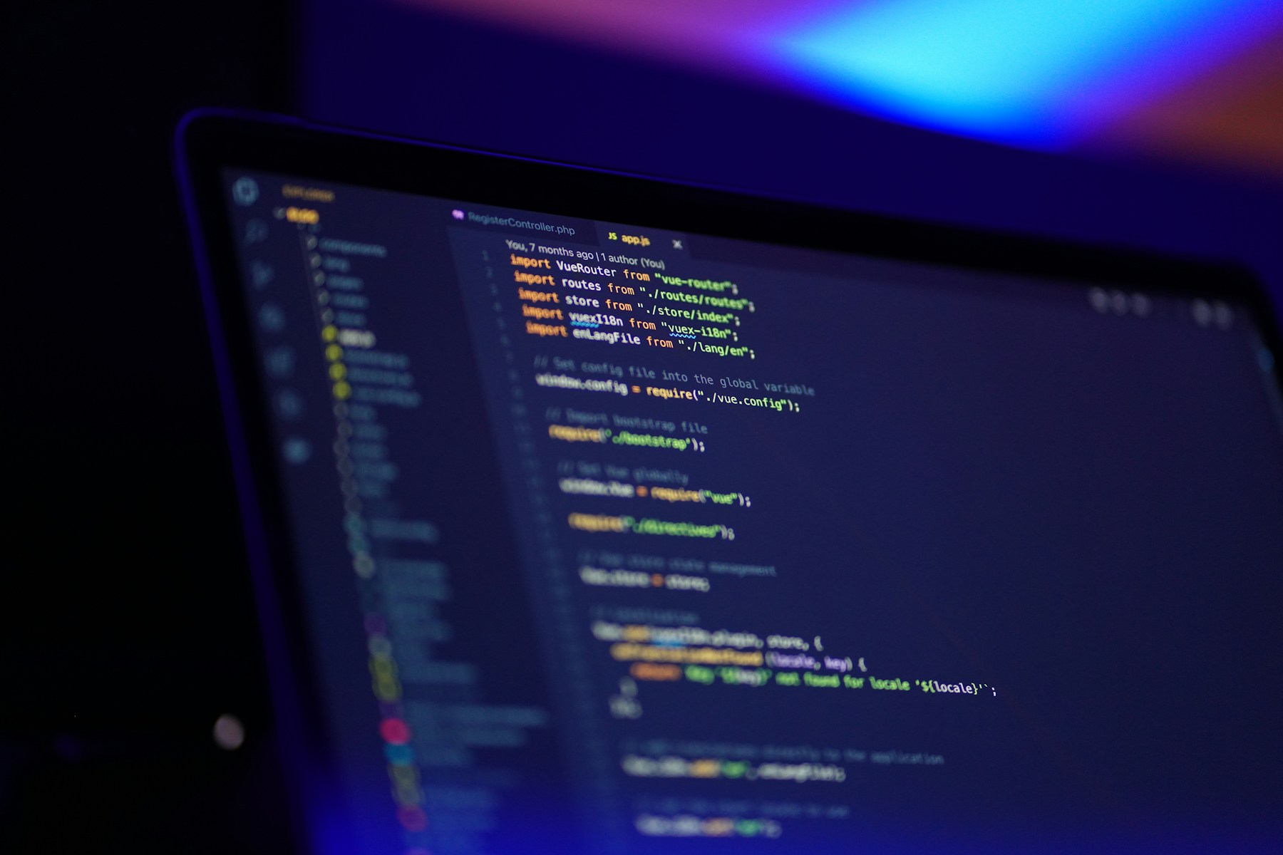 Laptop displaying colorful programming code for this Soran Ari article about AI and digital skills