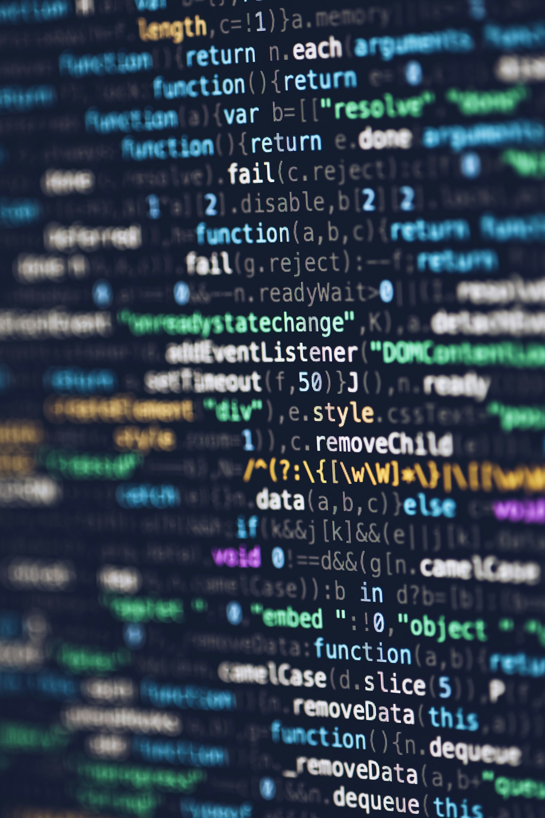 Web programming code displayed on a monitor for this Soran Ari article about Kurdish technology projects